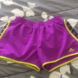 Purple adidas running shorts